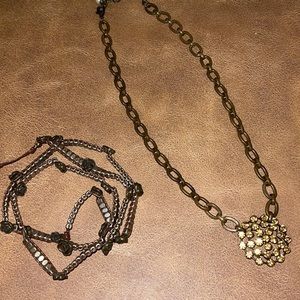 Plunder Crystal medallion necklace with a rwap leather bracelet.